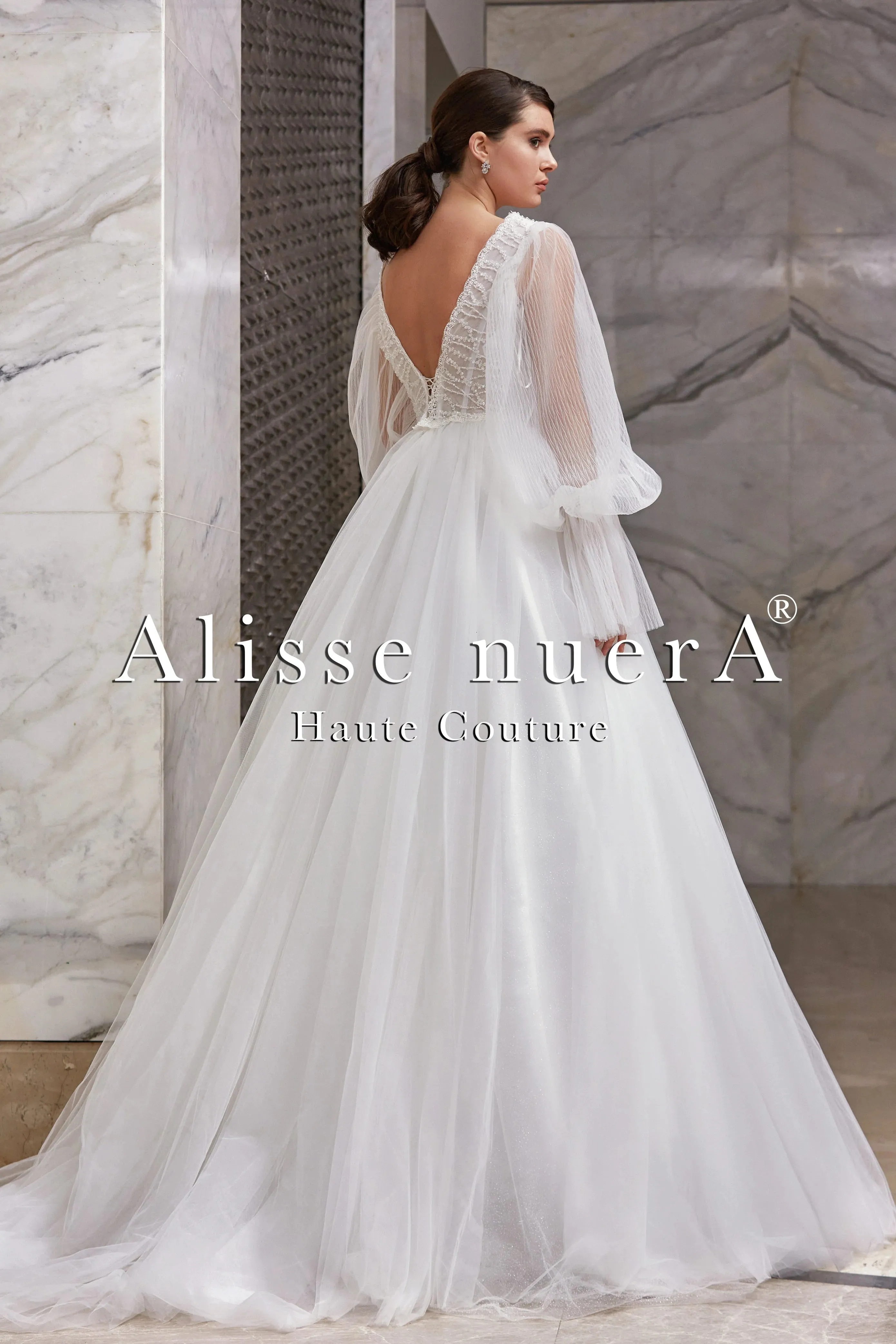 Empire Waist Wedding Dress Model with Long Balloon Sleeves and Deep V-Neck