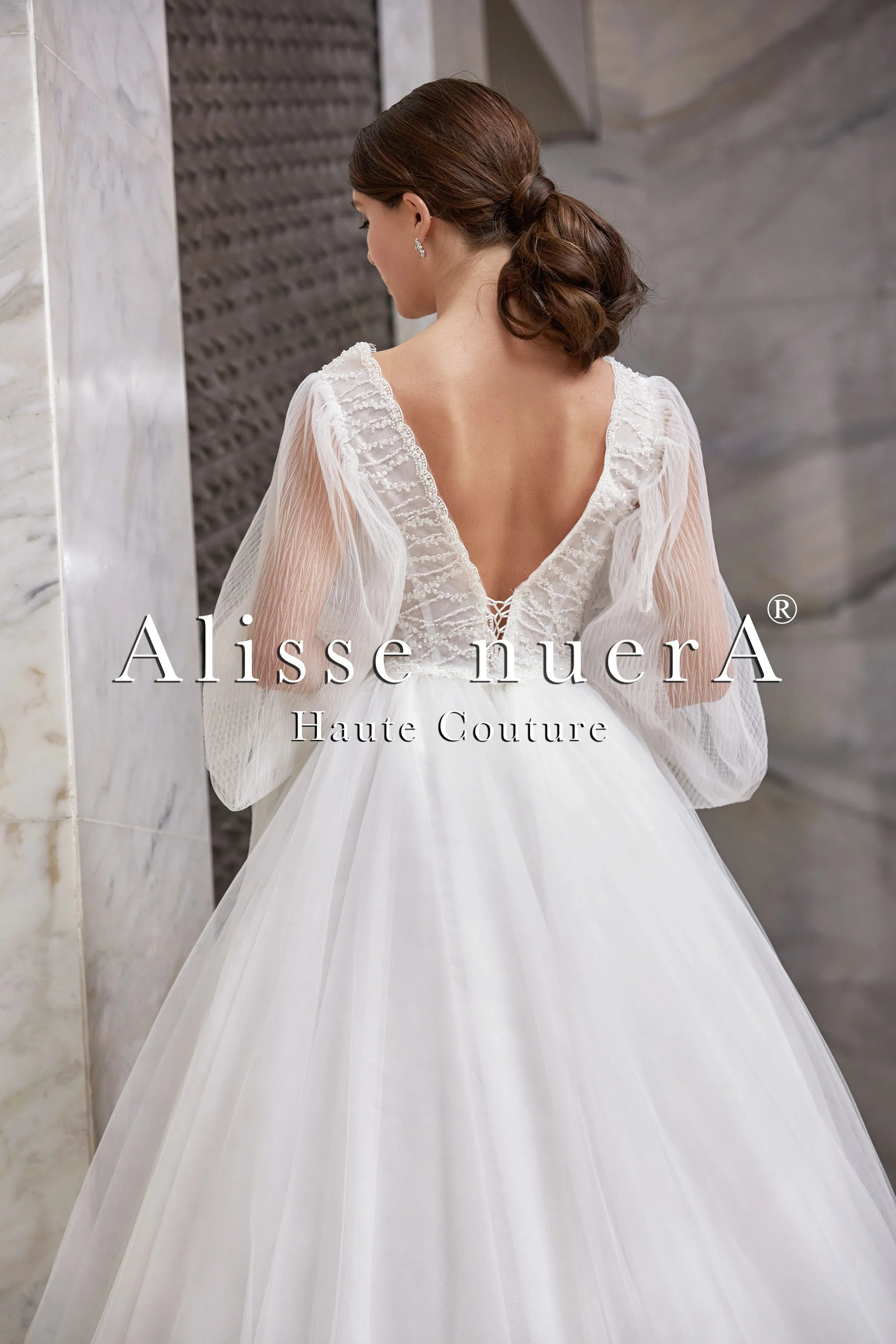 Empire Waist Wedding Dress Model with Long Balloon Sleeves and Deep V-Neck
